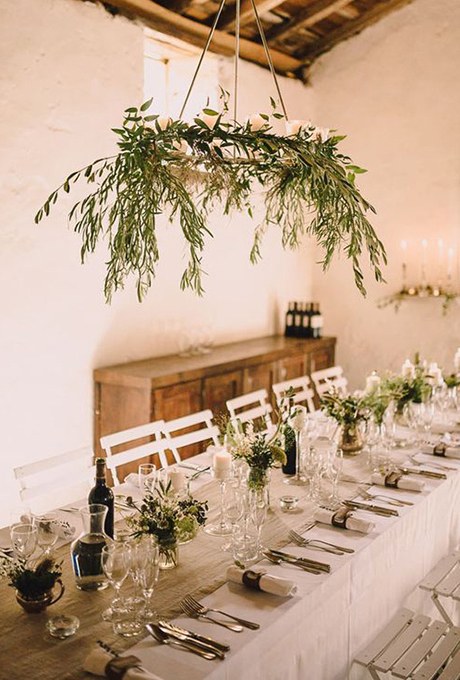  Wispy olive branches are the perfect match for this low-key reception setup 